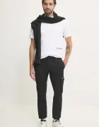 Calvin Klein Jeans Панталон в черно с кройка по тялото J30J327614