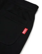 Diesel панталон джогър за деца с памук PRES TROUSERS черен със стандартна талия J03031