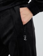 Juicy Couture Спортен панталон в черно с апликация