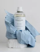 Steamery Течност за пране на тъкани Signature Laundry Detergent в бяло