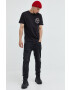 Tommy Jeans Памучна тениска в черно с апликация - Pepit.bg
