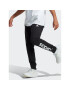 adidas Долнище анцуг Essentials French Terry Tapered Cuff Logo Joggers IC0063 Черен Regular Fit - Pepit.bg