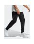 adidas Долнище анцуг Essentials French Terry Tapered Cuff Logo Joggers IC0063 Черен Regular Fit - Pepit.bg