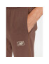 New Balance Долнище анцуг NB Essentials Sweatpant MP33509 Кафяв Regular Fit - Pepit.bg