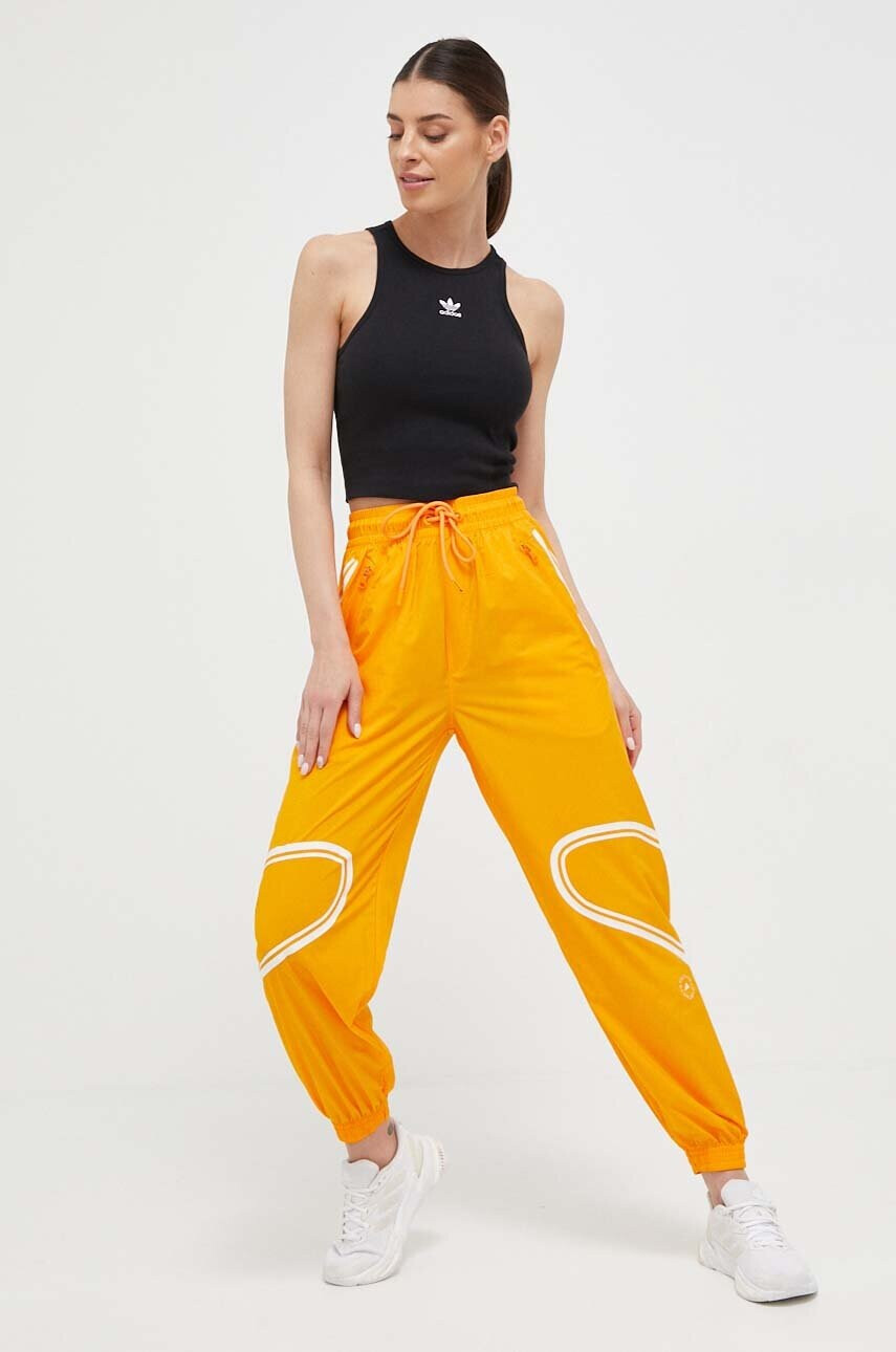 adidas by Stella McCartney Панталон за трениране TruePace в оранжево с принт - Pepit.bg