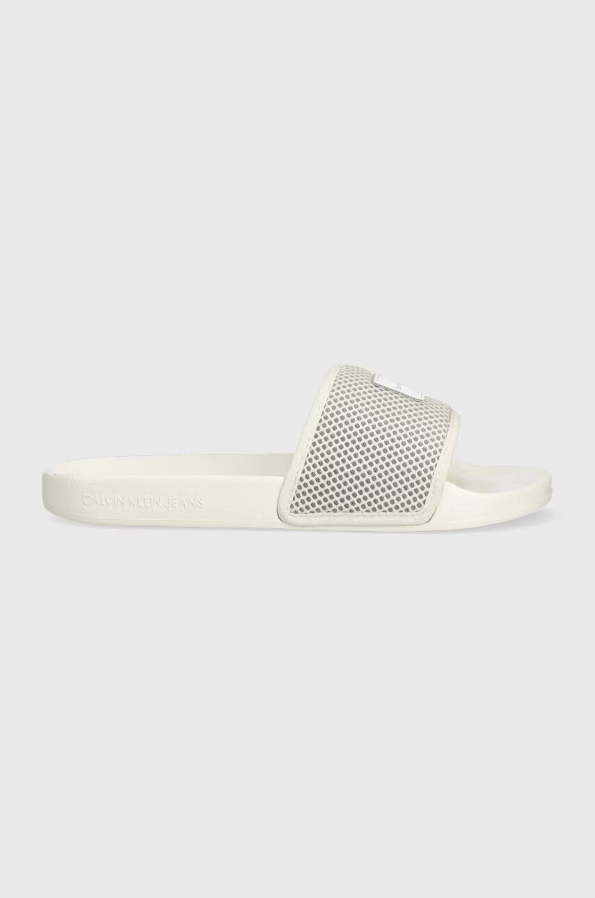 Calvin Klein Jeans Чехли SLIDE BADGE WN в бежово YW0YW00997 - Pepit.bg