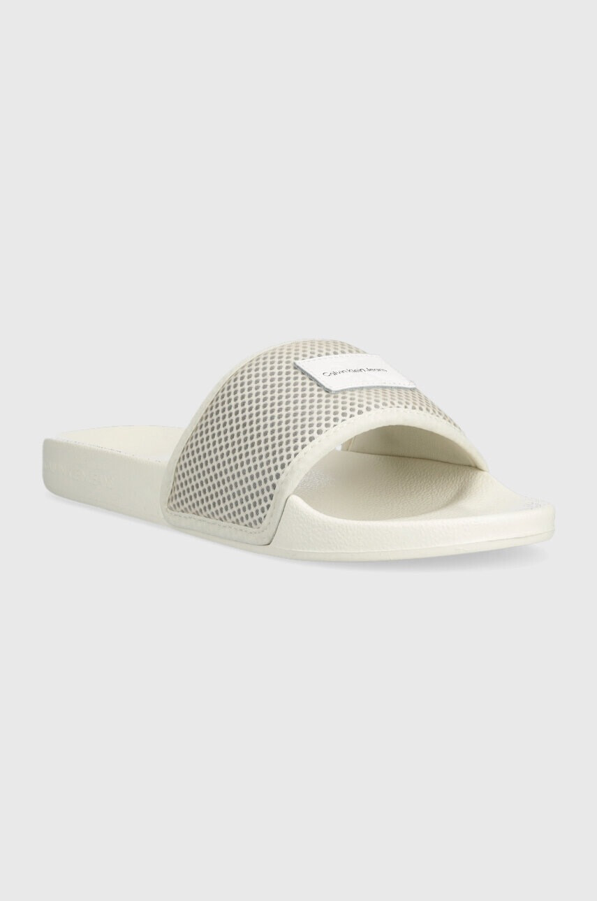 Calvin Klein Jeans Чехли SLIDE BADGE WN в бежово YW0YW00997 - Pepit.bg