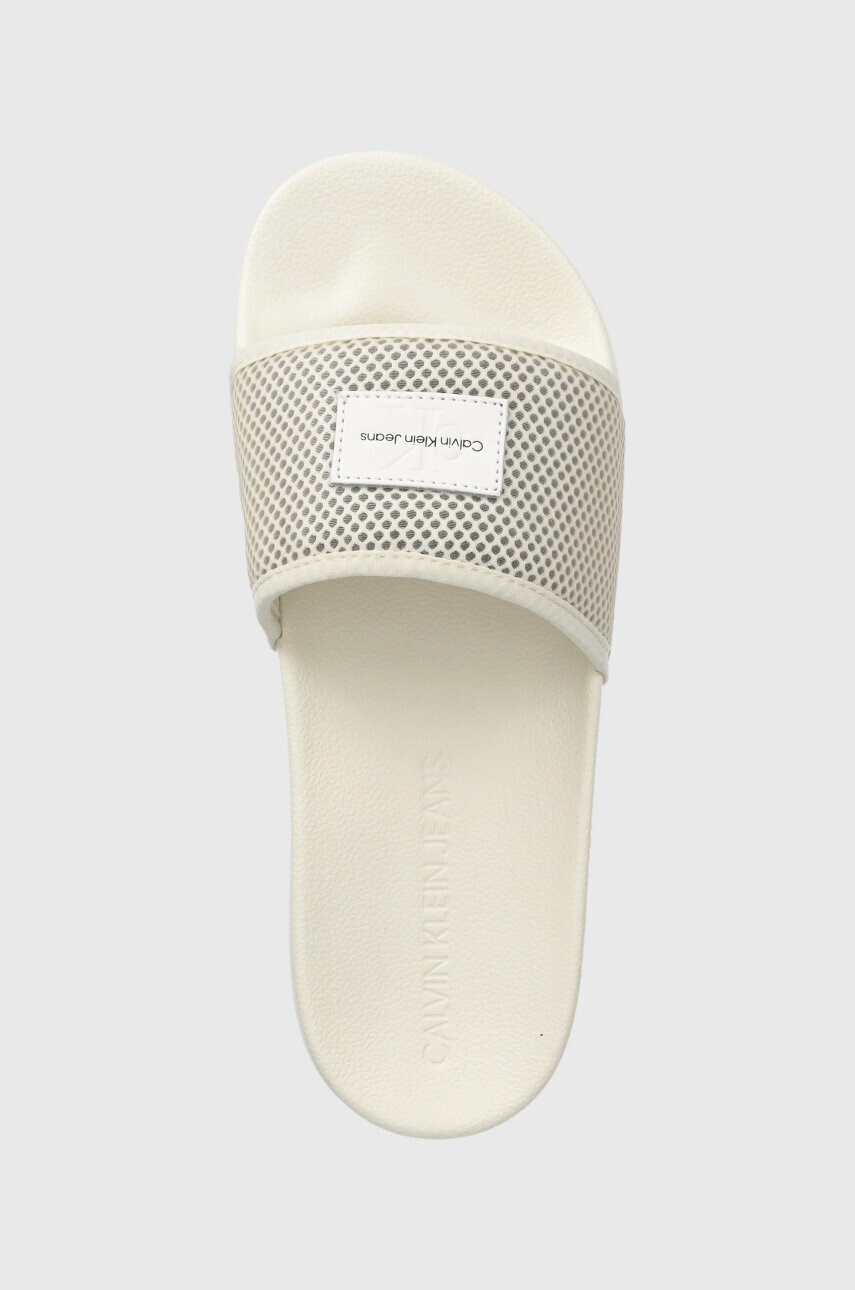 Calvin Klein Jeans Чехли SLIDE BADGE WN в бежово YW0YW00997 - Pepit.bg