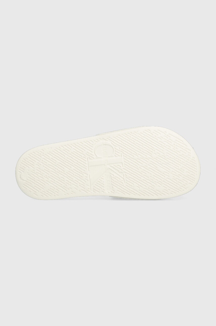 Calvin Klein Jeans Чехли SLIDE BADGE WN в бежово YW0YW00997 - Pepit.bg