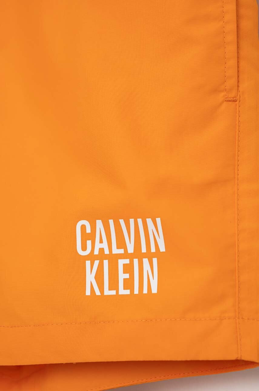 Calvin Klein Jeans Детски плувни шорти в оранжево - Pepit.bg