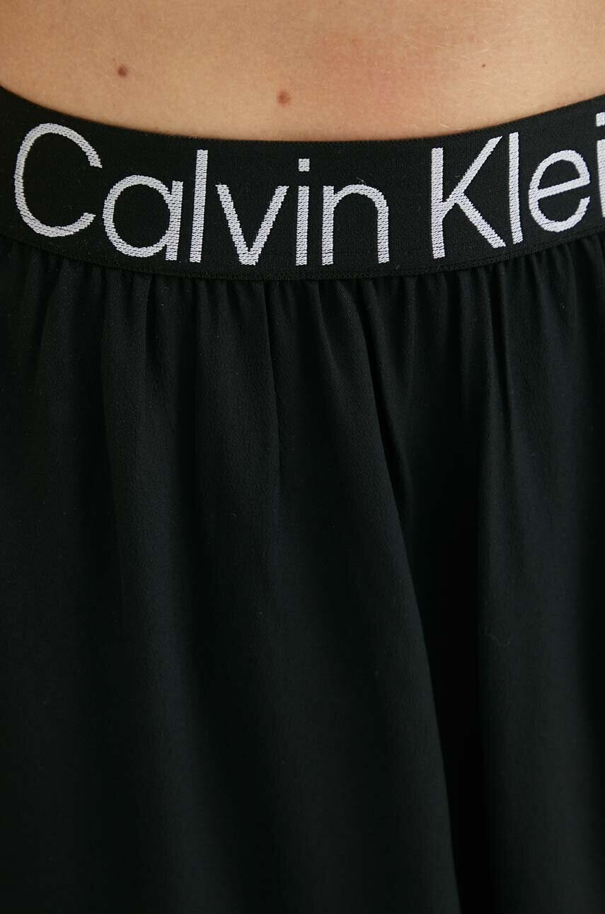 Calvin Klein Jeans Пола в черно къс модел разкроен модел - Pepit.bg