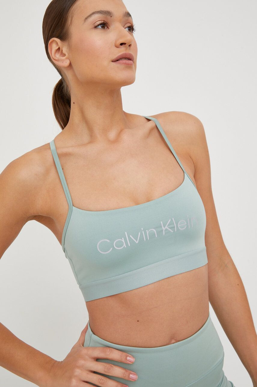 Calvin Klein Performance Спортен сутиен Ck Essentials в тюркоазено - Pepit.bg