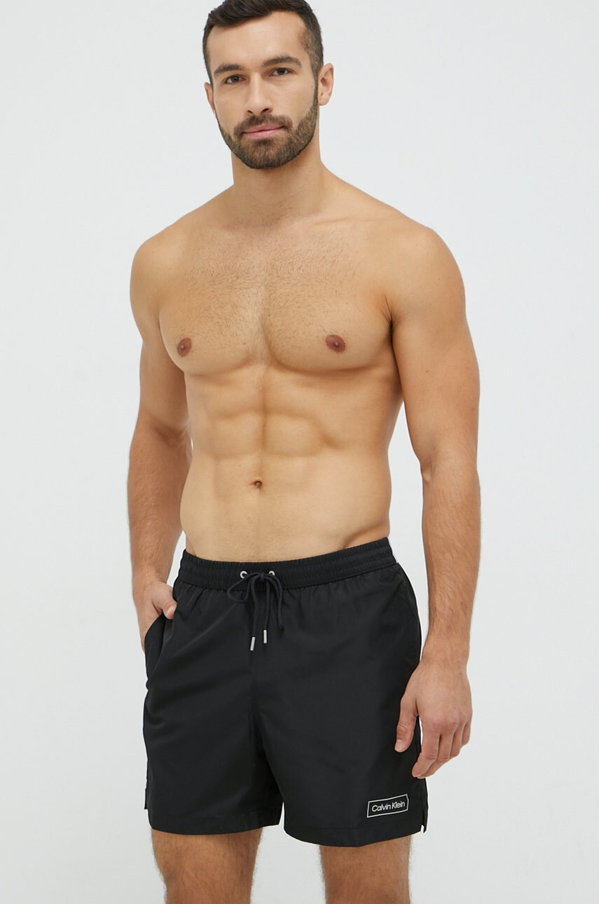 Calvin Klein Плувни шорти в черно - Pepit.bg