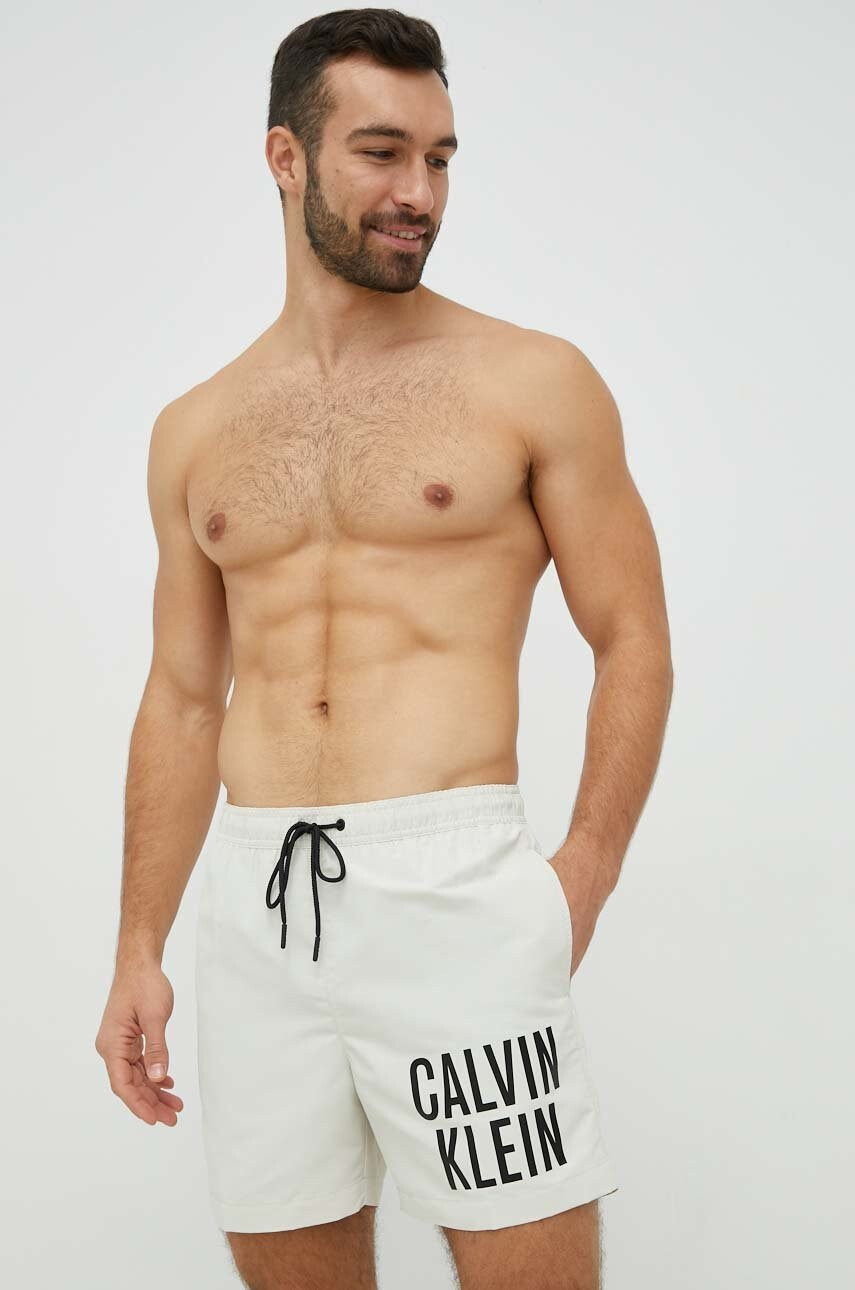 Calvin Klein Плувни шорти в бежово - Pepit.bg