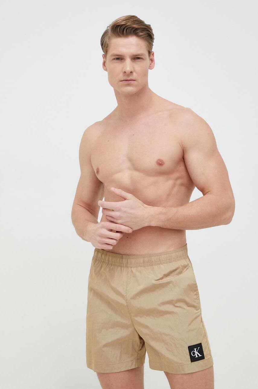 Calvin Klein Плувни шорти в бежово - Pepit.bg