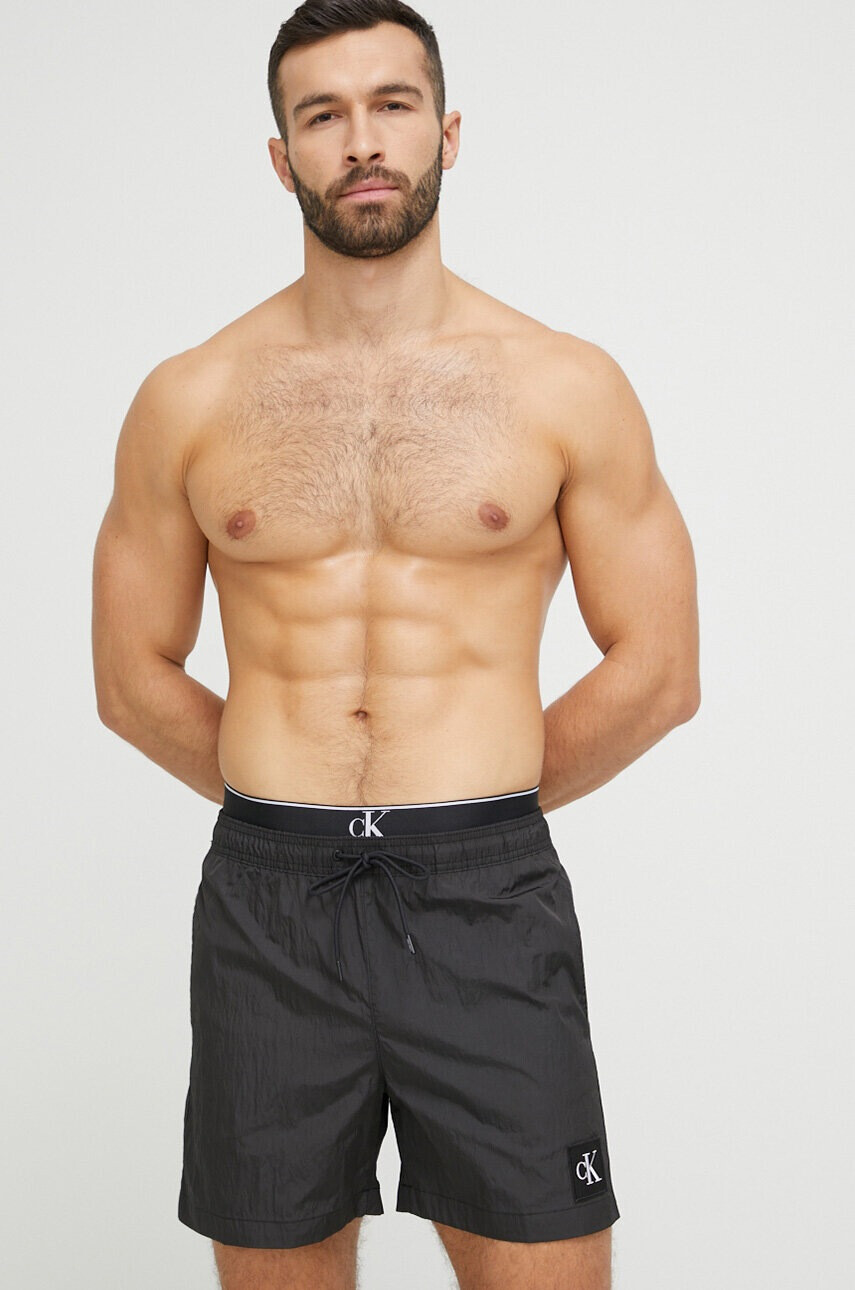 Calvin Klein Плувни шорти в черно - Pepit.bg