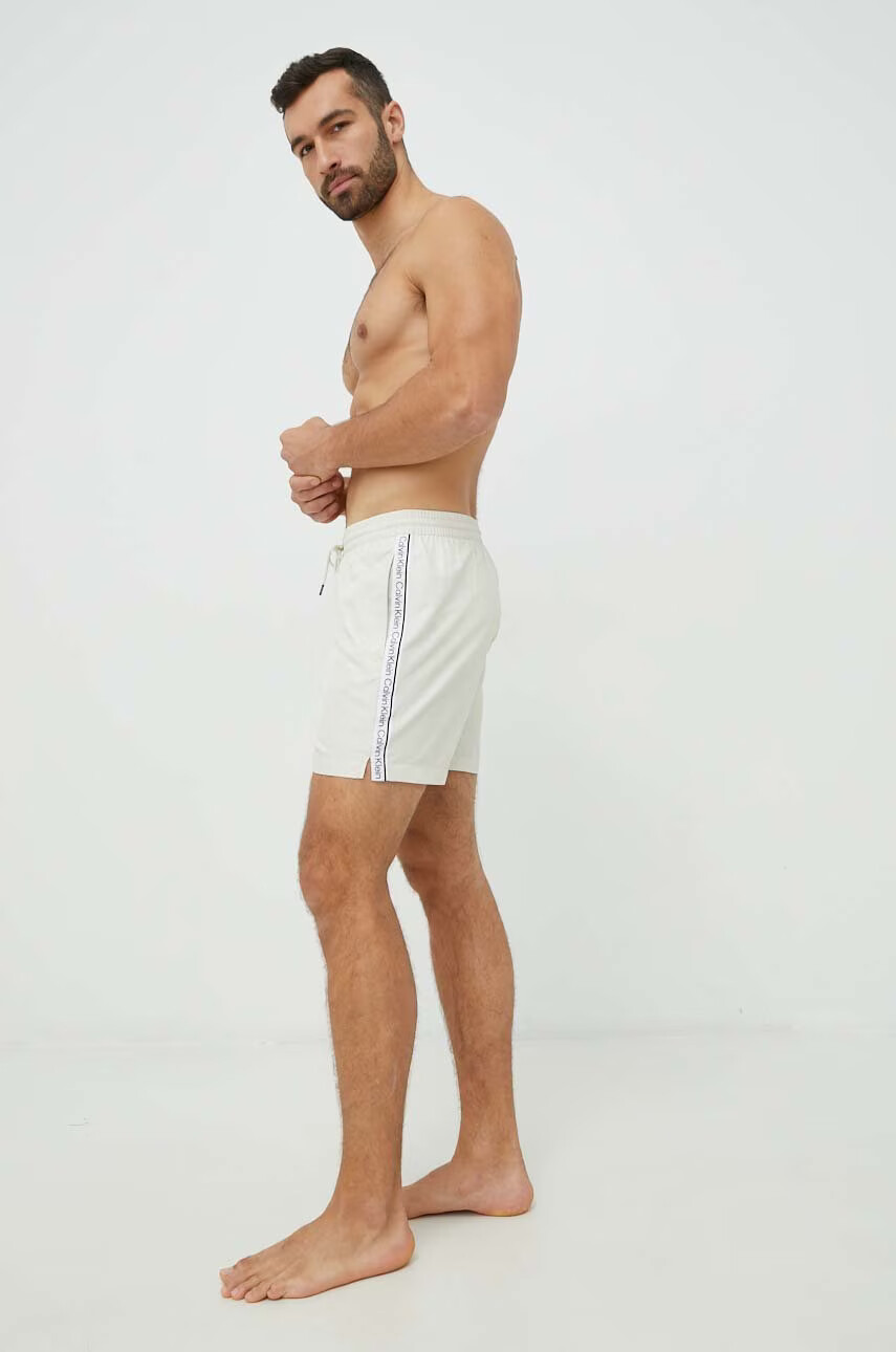 Calvin Klein Плувни шорти в бежово - Pepit.bg