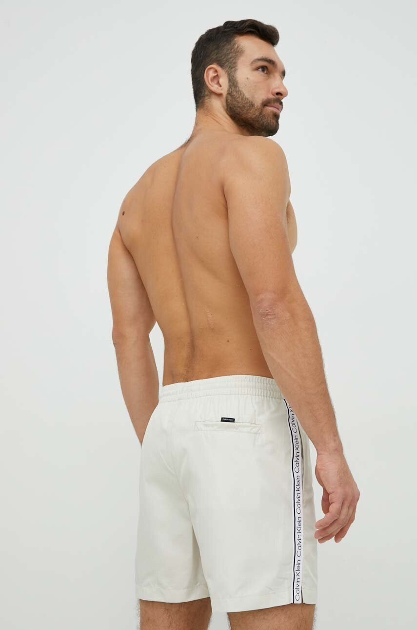 Calvin Klein Плувни шорти в бежово - Pepit.bg