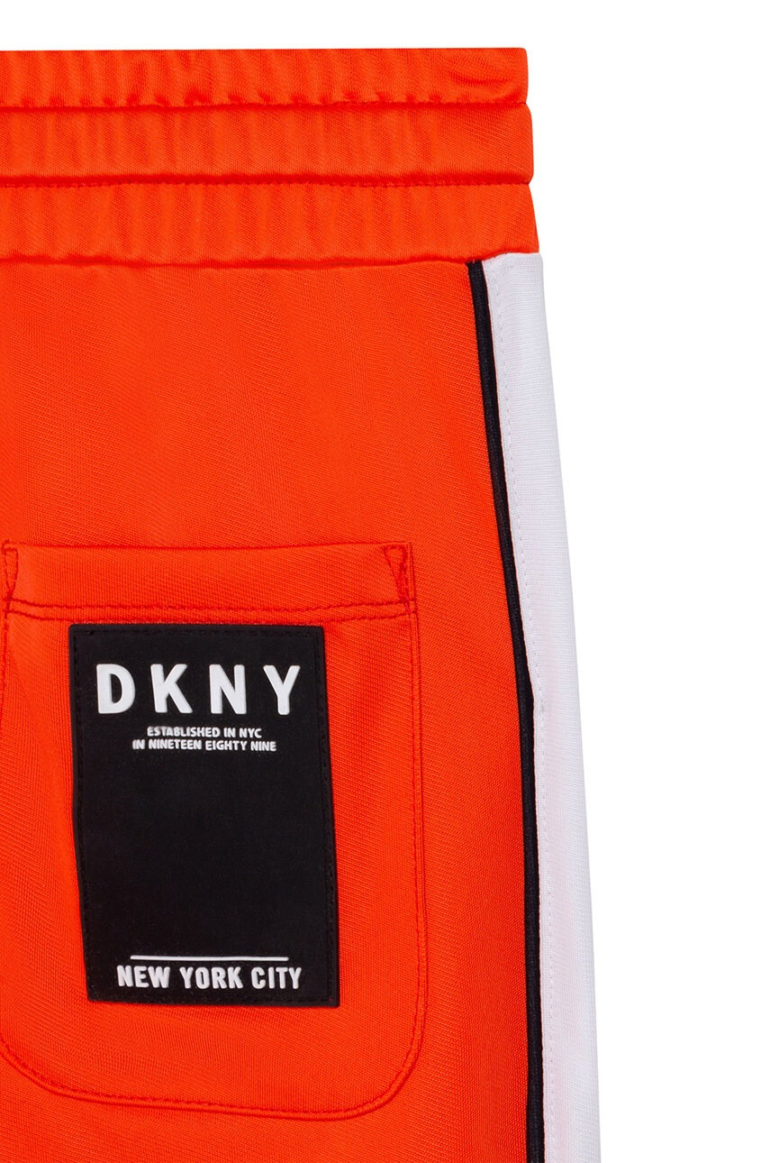 DKNY Детски панталони в оранжево с десен - Pepit.bg