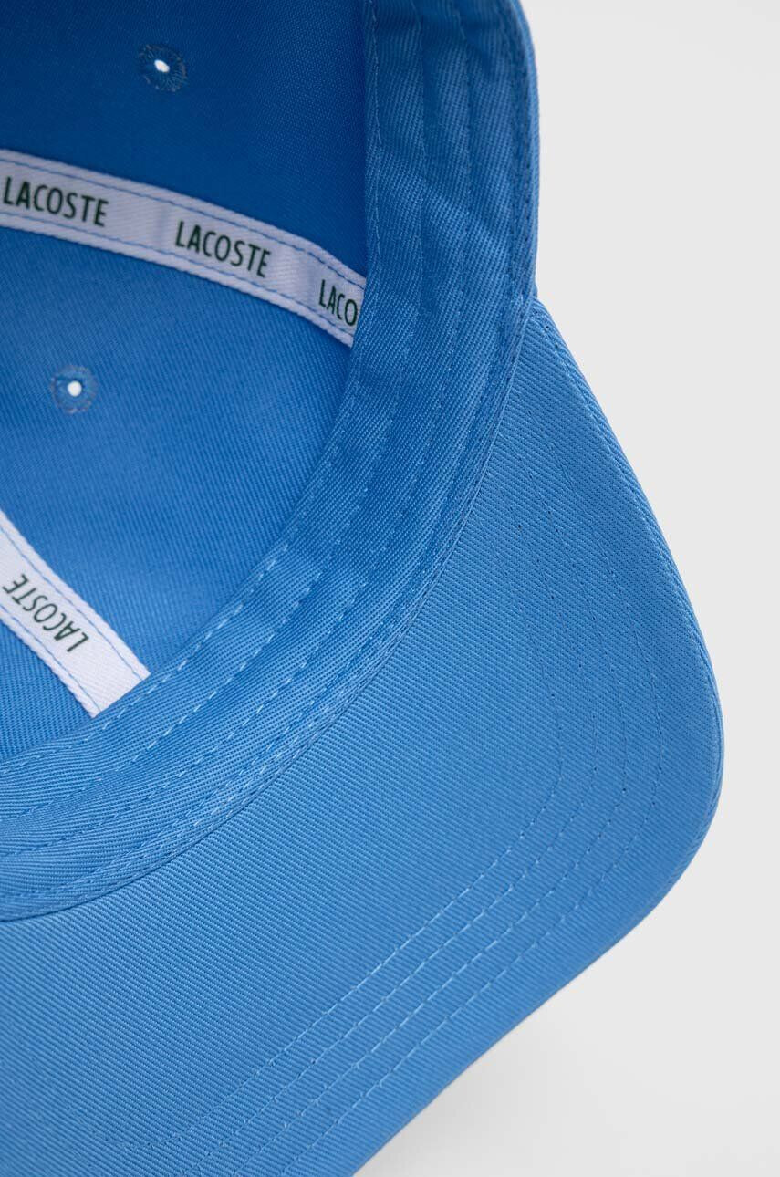 Lacoste Памучна шапка с козирка в синьо с изчистен дизайн - Pepit.bg