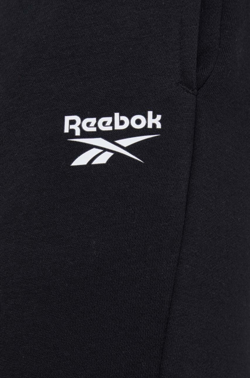 Reebok Панталони в черно с принт - Pepit.bg