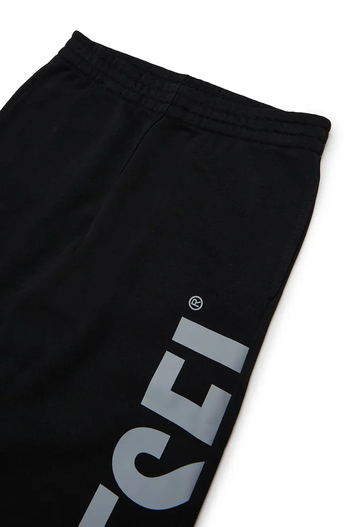 Diesel панталон джогър за деца с памук PRES TROUSERS черен със стандартна талия J03031