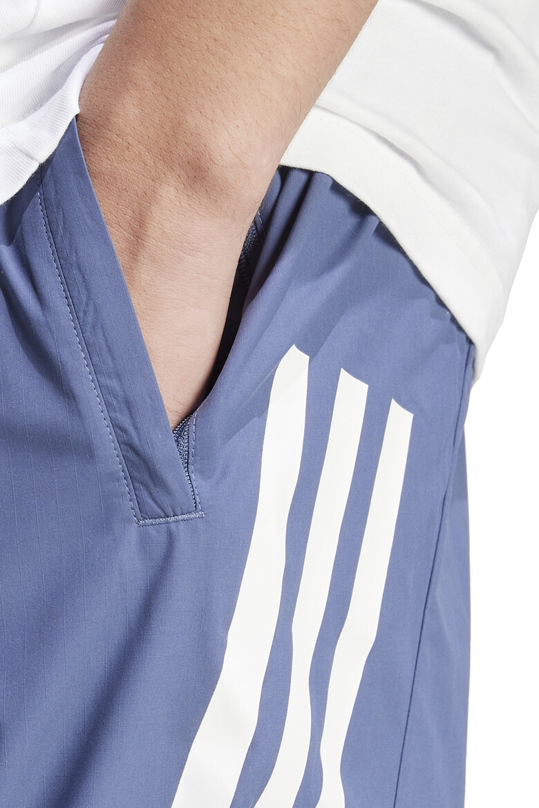 adidas Sportswear Непромокаем спортен панталон Future Icons с 3 ивици - Pepit.bg