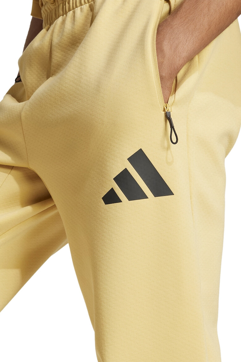 adidas Sportswear Спортен панталон Z.N.E. с джобове с цип - Pepit.bg