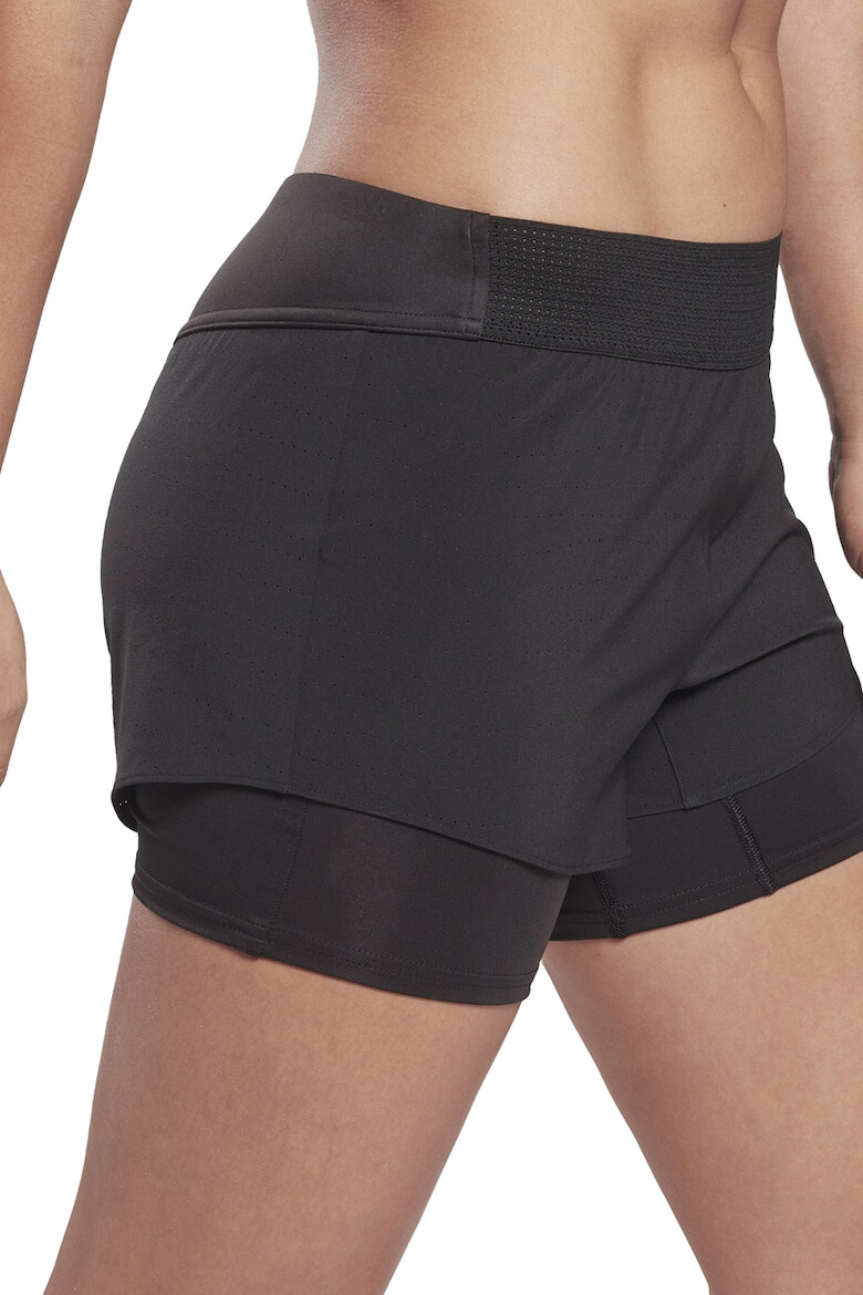 Reebok Фитнес шорти с дизайн 2в1 - Pepit.bg