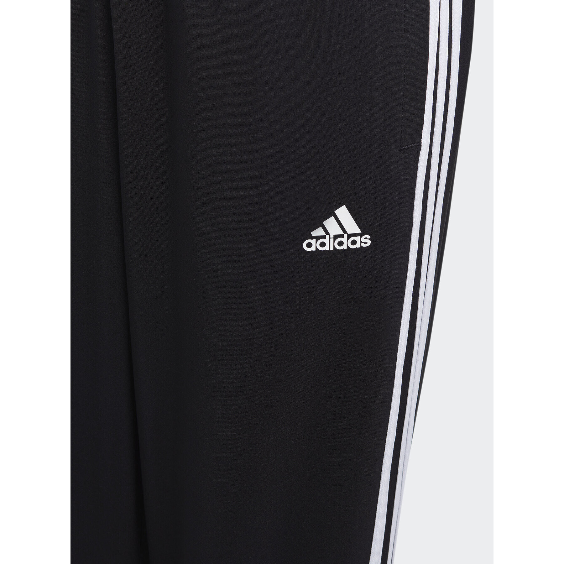 adidas Долнище анцуг Essentials 3-Stripes Woven Tracksuit Bottoms HR6334 Черен Slim Fit - Pepit.bg