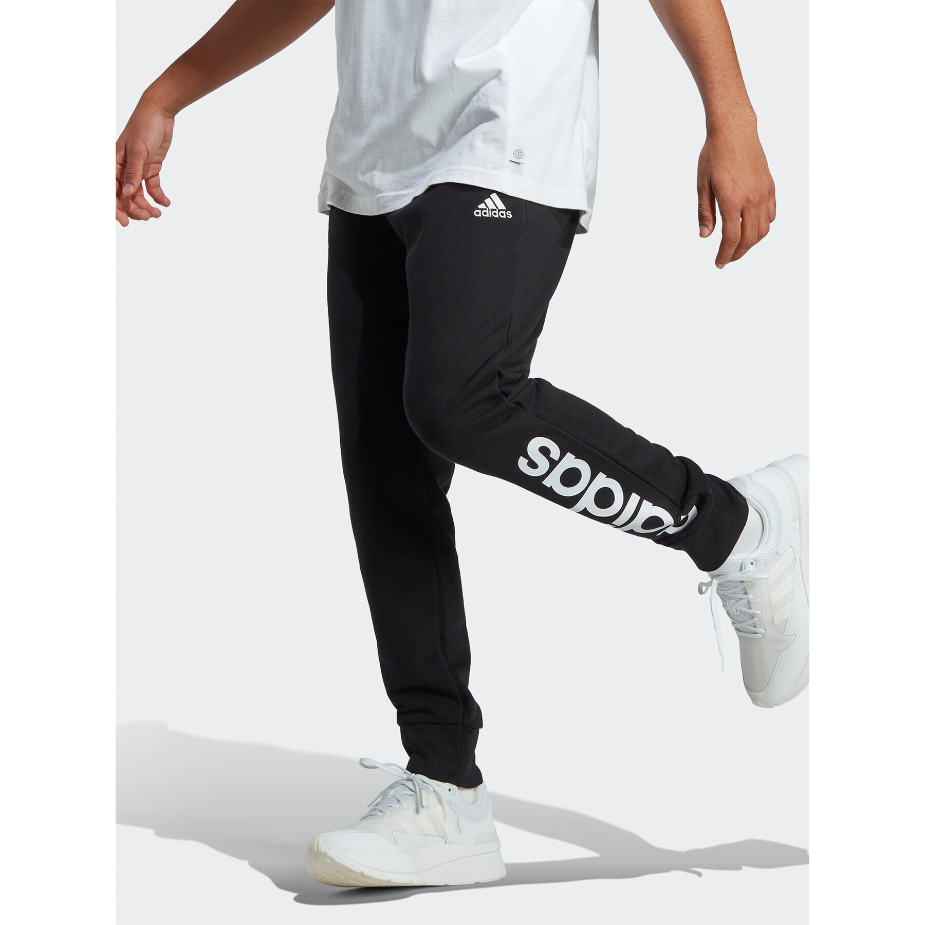 adidas Долнище анцуг Essentials French Terry Tapered Cuff Logo Joggers IC0063 Черен Regular Fit - Pepit.bg