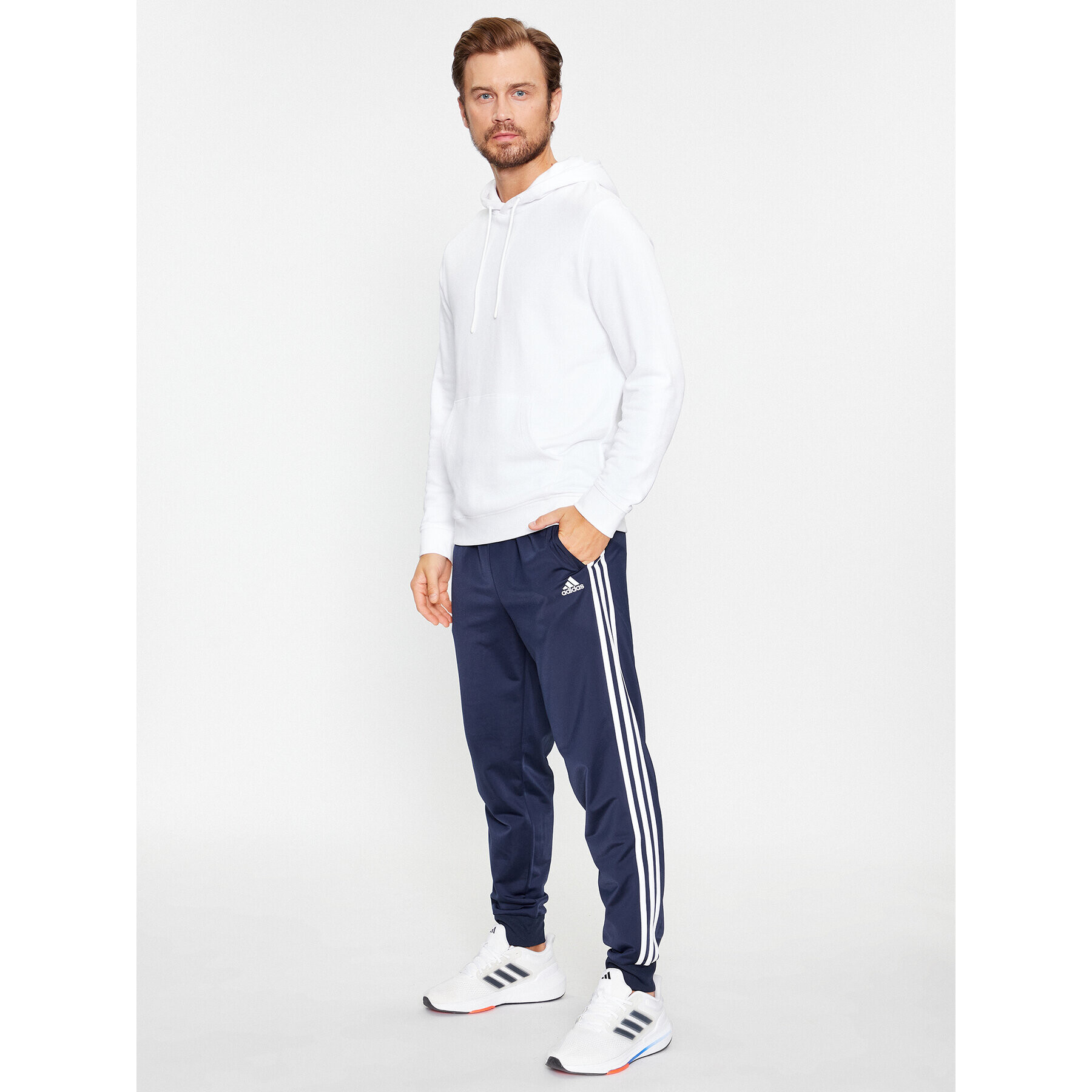 adidas Долнище анцуг Essentials Warm-Up 3-Stripes H46106 Тъмносин Regular Fit - Pepit.bg
