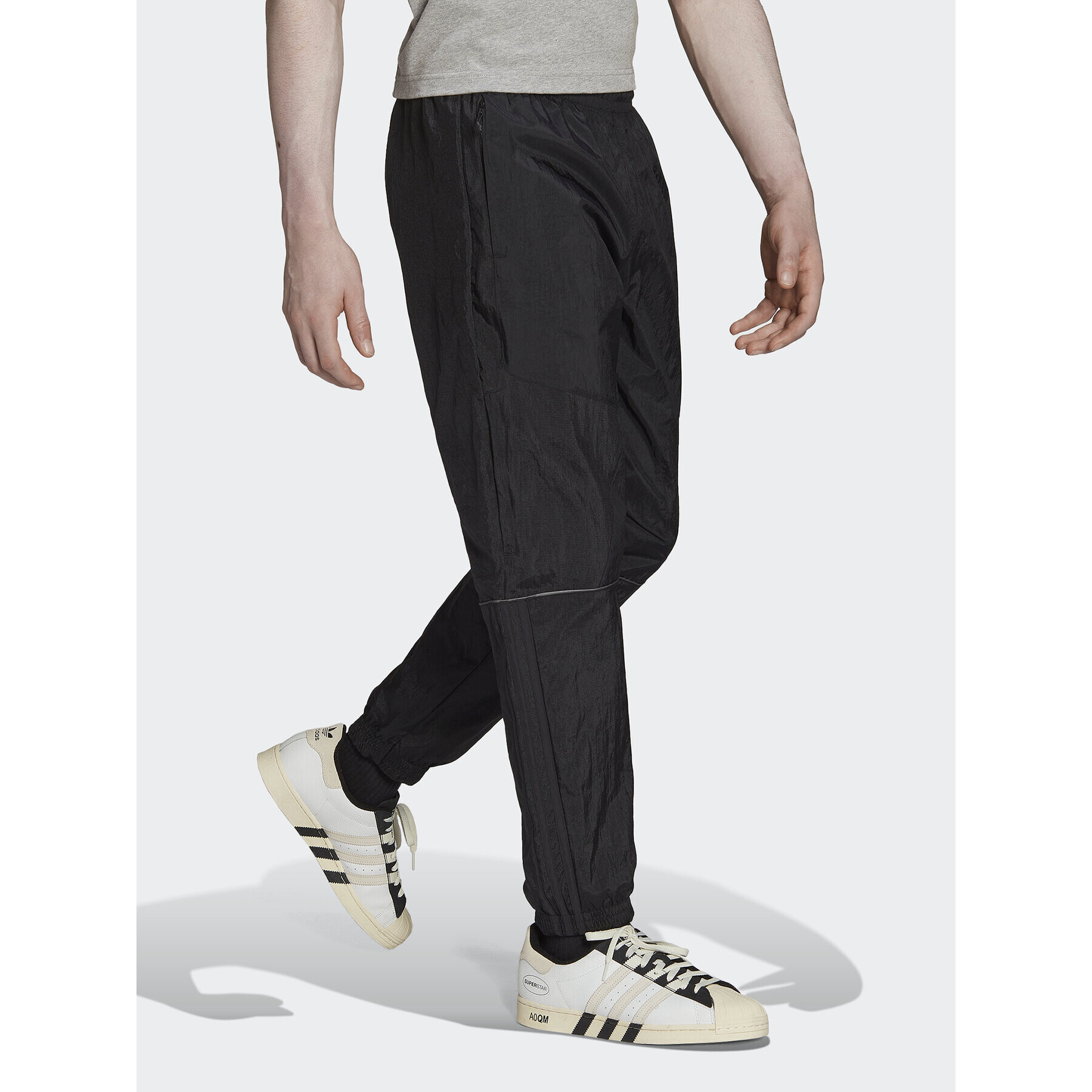 adidas Долнище анцуг Reveal Material Mix HK2732 Черен Regular Fit - Pepit.bg