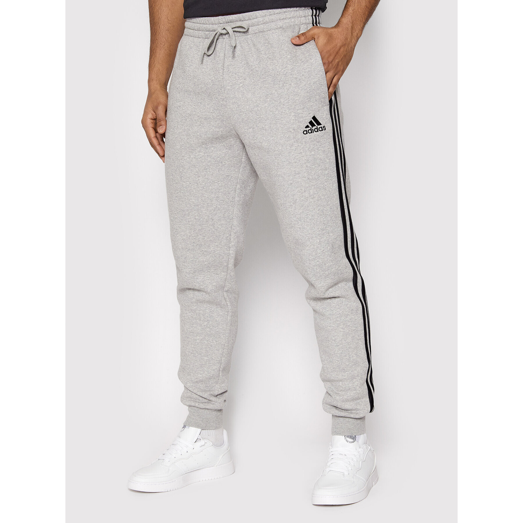 adidas Долнище анцуг Essentials 3-Stripes GM1091 Сив Slim Fit - Pepit.bg