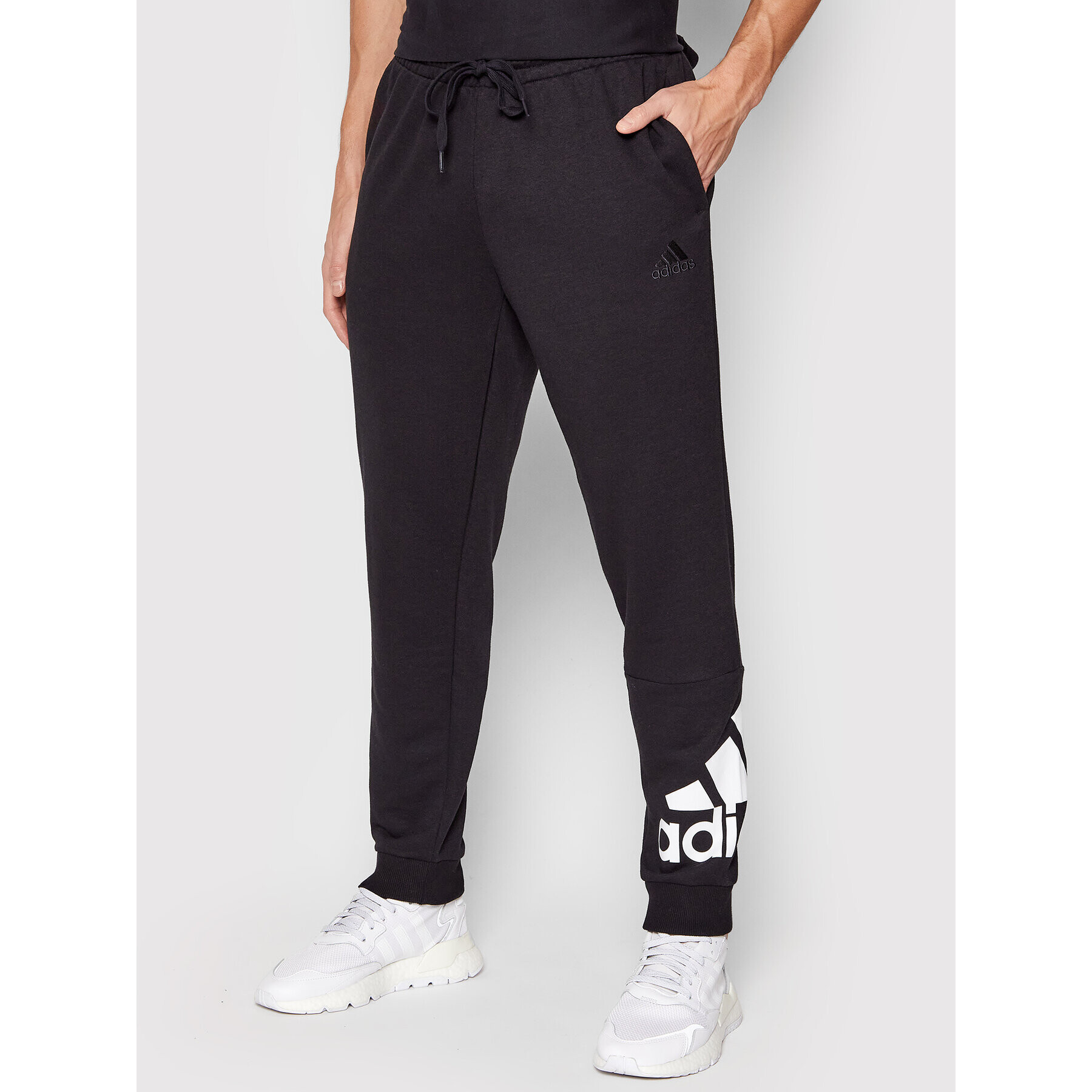 adidas Долнище анцуг Essentials GK8968 Черен Regular Fit - Pepit.bg