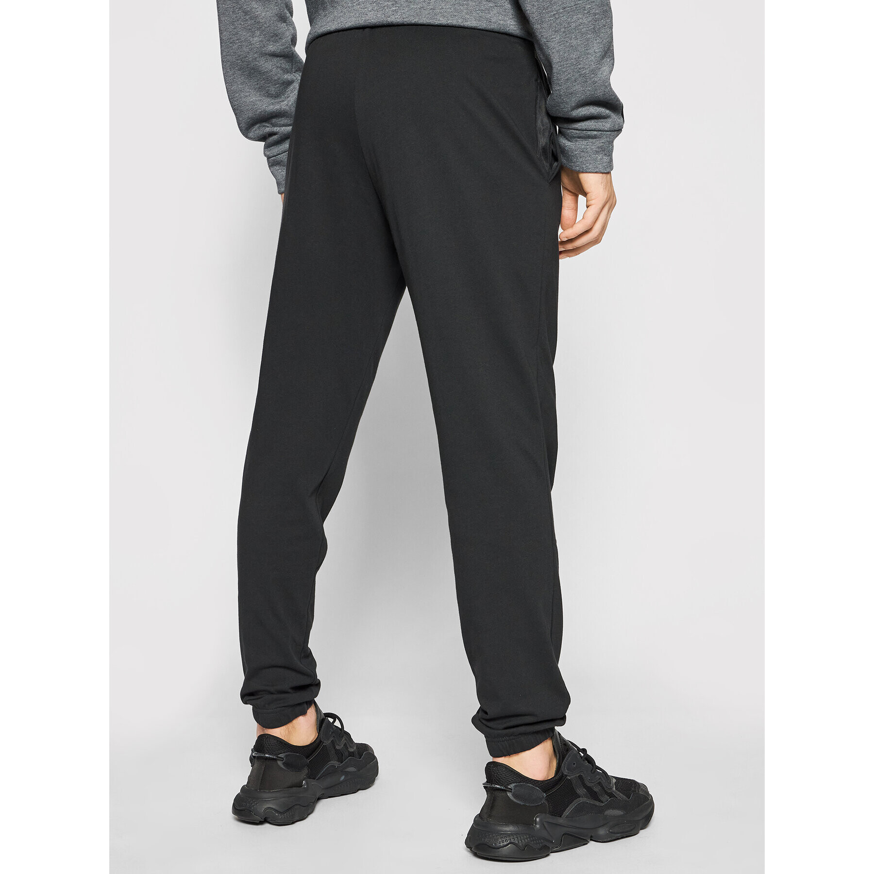 adidas Долнище анцуг Essentials Single Jersey GK8827 Черен Regular Fit - Pepit.bg