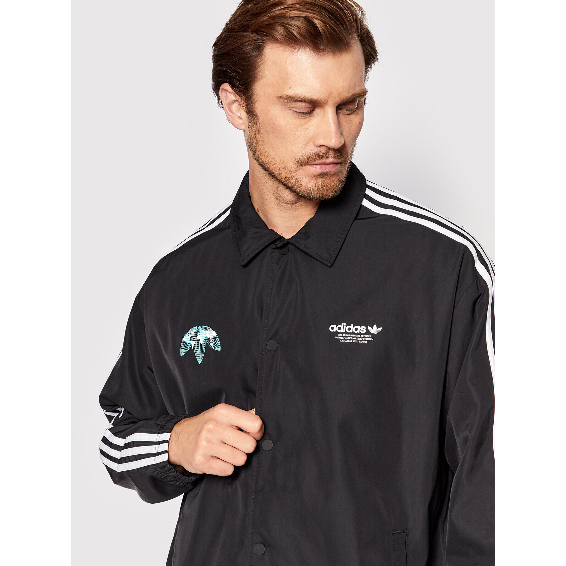 adidas Преходно яке Graphics United Coach HF4895 Черен Regular Fit - Pepit.bg