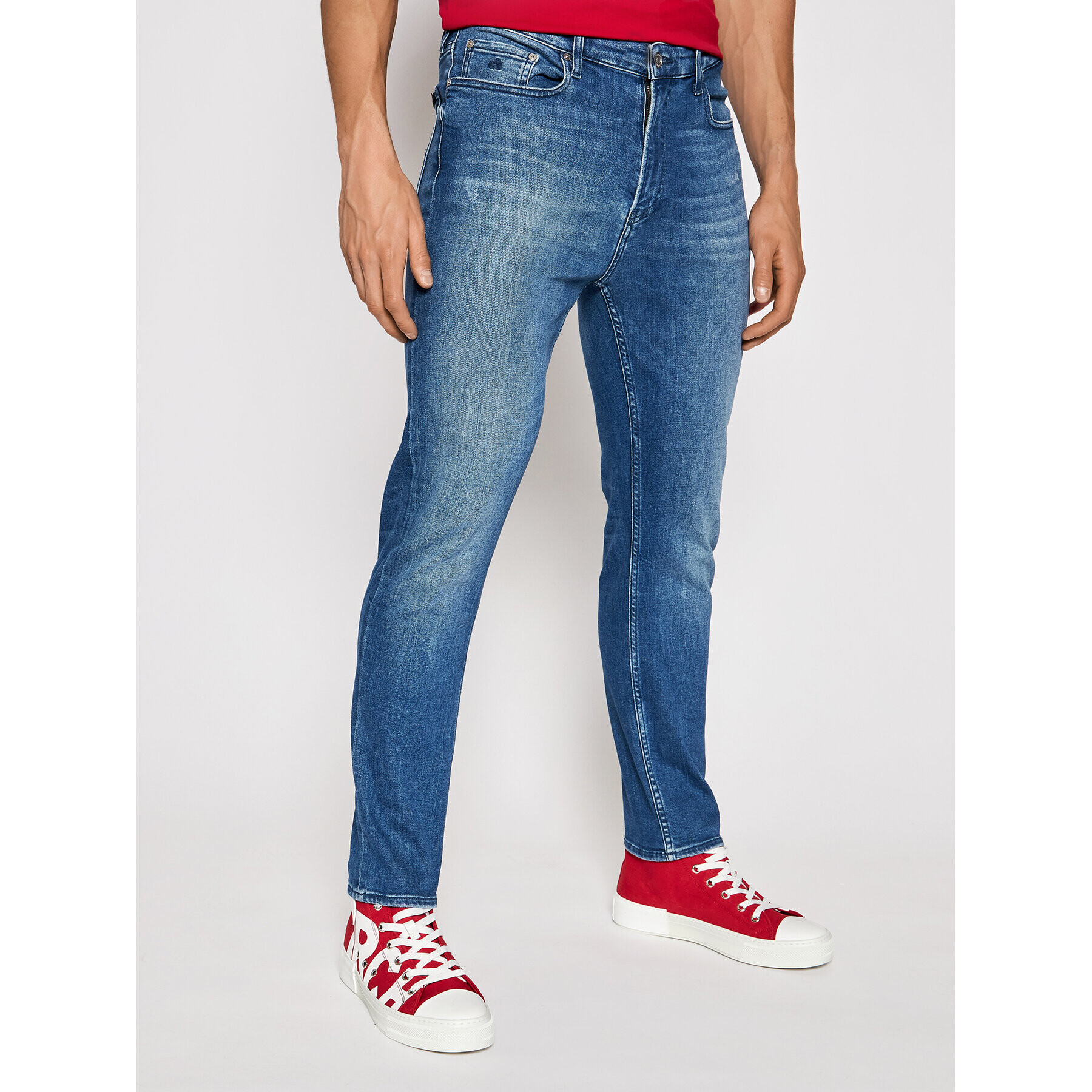 Calvin Klein Дънки Destructed K10K106789 Син Tapered Fit - Pepit.bg