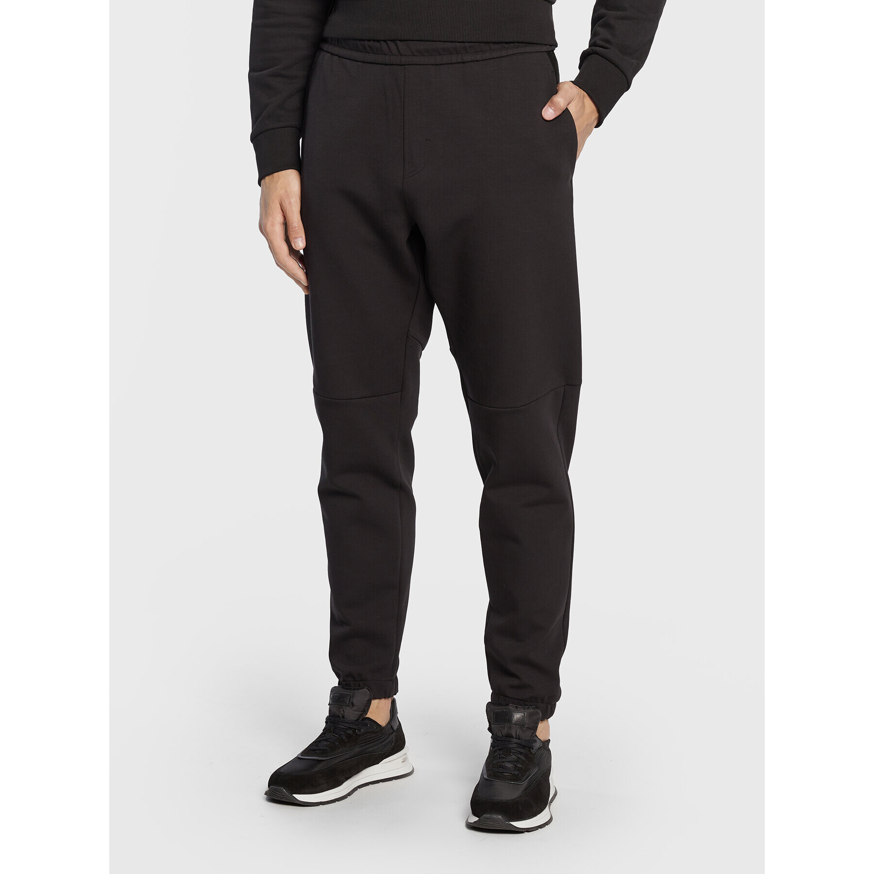 Calvin Klein Долнище анцуг Embossed Rib K10K110880 Черен Relaxed Fit - Pepit.bg