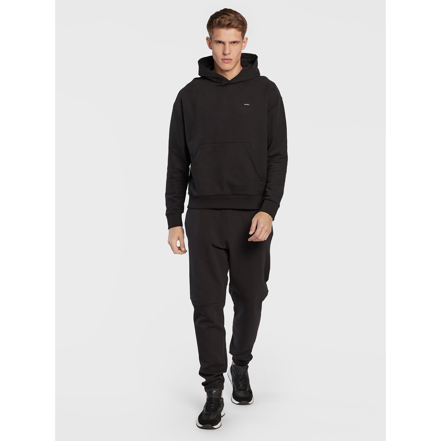 Calvin Klein Долнище анцуг Embossed Rib K10K110880 Черен Relaxed Fit - Pepit.bg