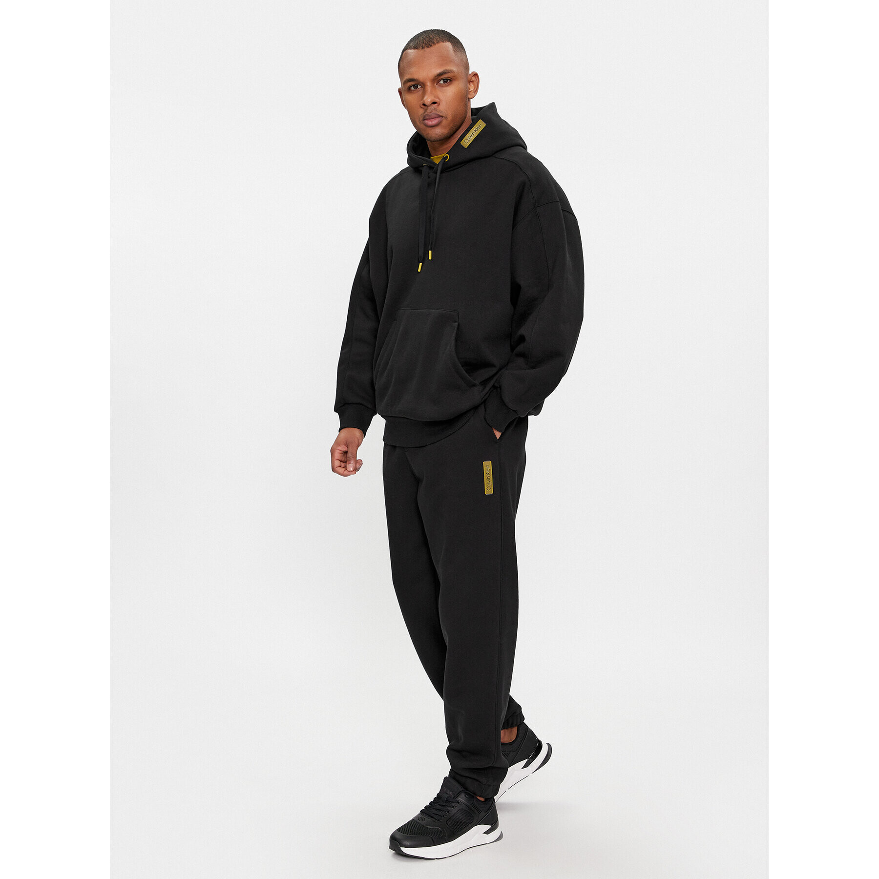 Calvin Klein Долнище анцуг Grid Logo K10K112430 Черен Relaxed Fit - Pepit.bg