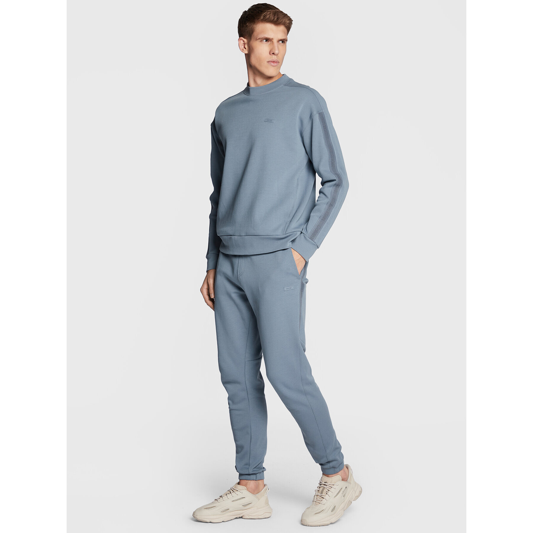 Calvin Klein Долнище анцуг Logo Tape K10K110820 Сив Regular Fit - Pepit.bg