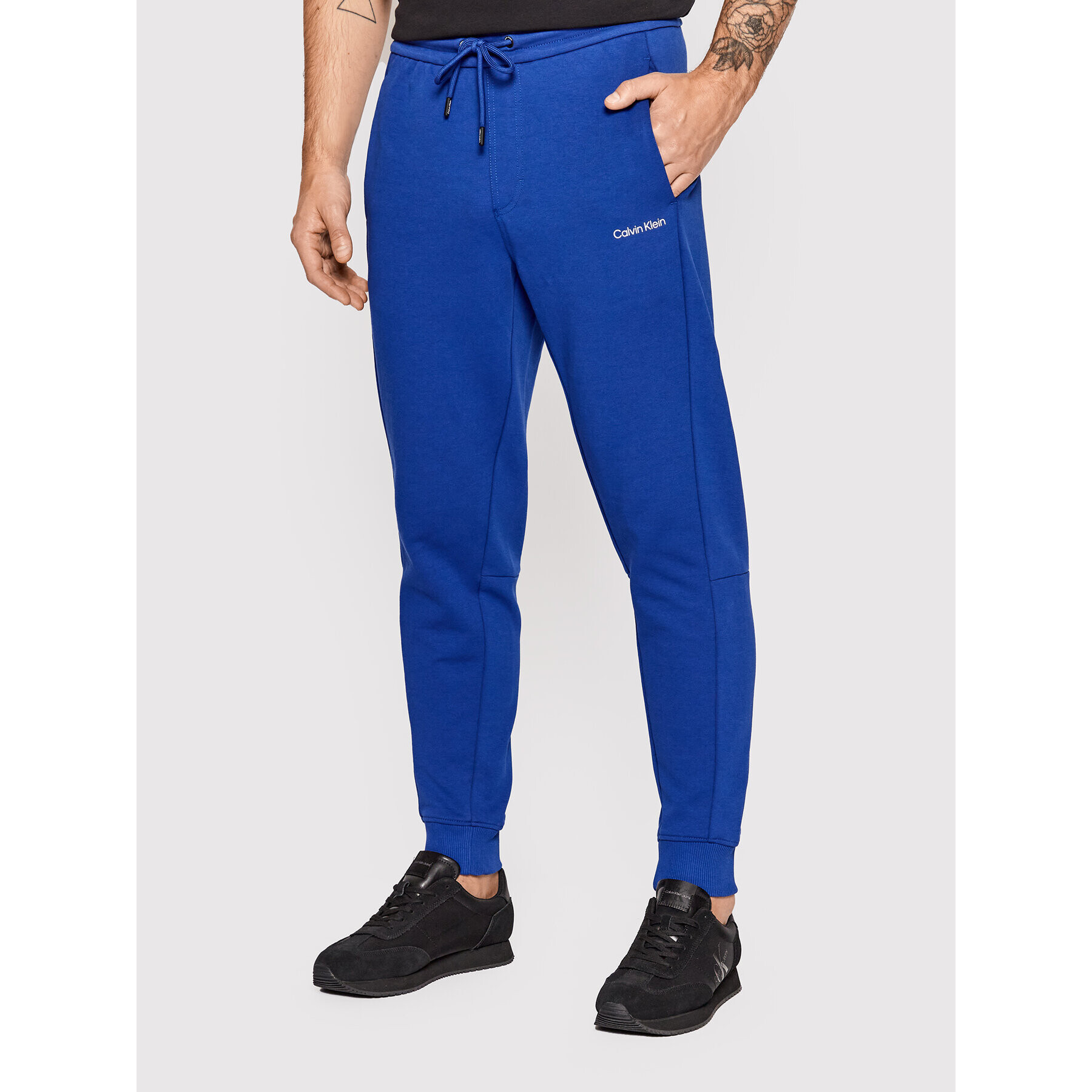 Calvin Klein Долнище анцуг Interlock K10K108941 Син Regular Fit - Pepit.bg