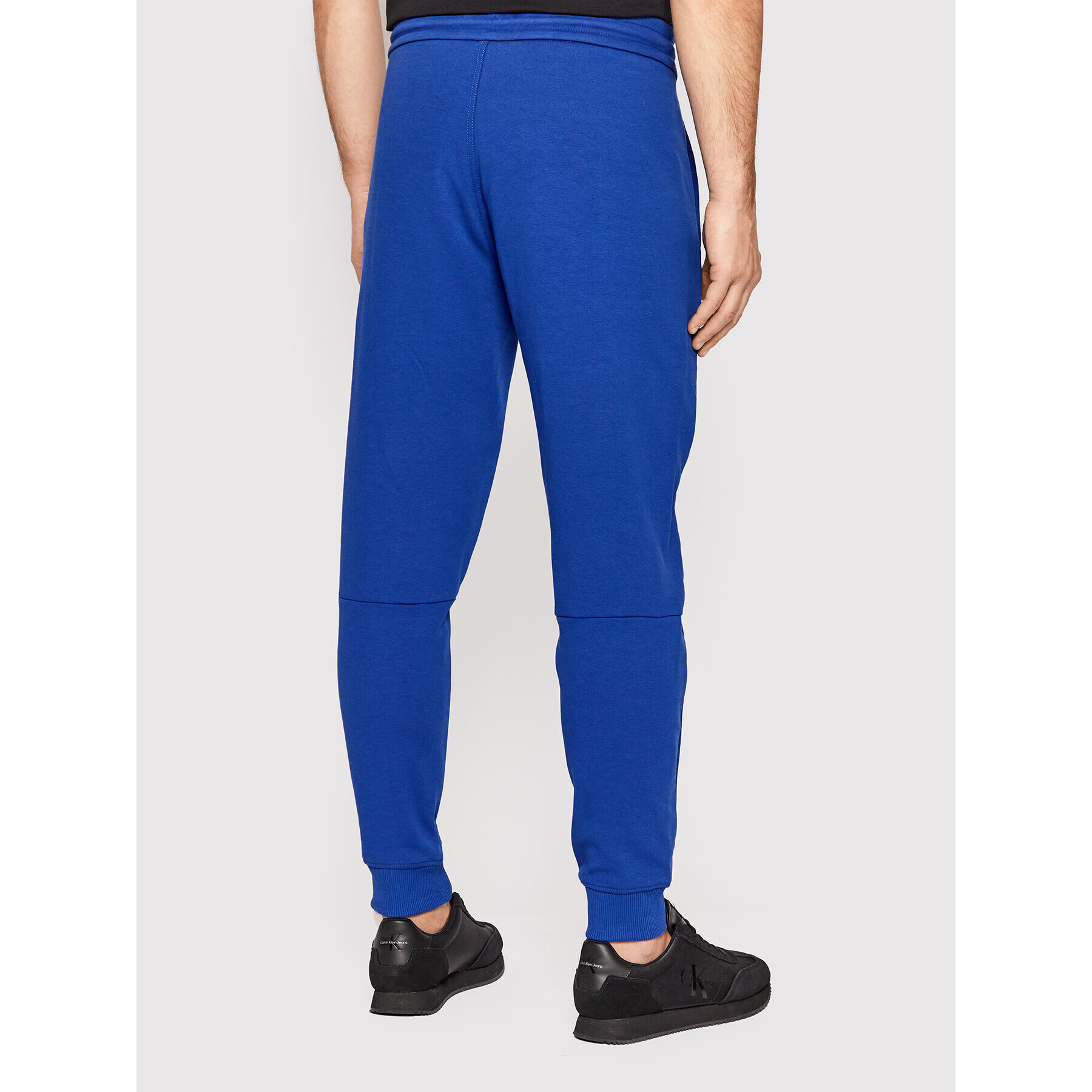 Calvin Klein Долнище анцуг Interlock K10K108941 Син Regular Fit - Pepit.bg