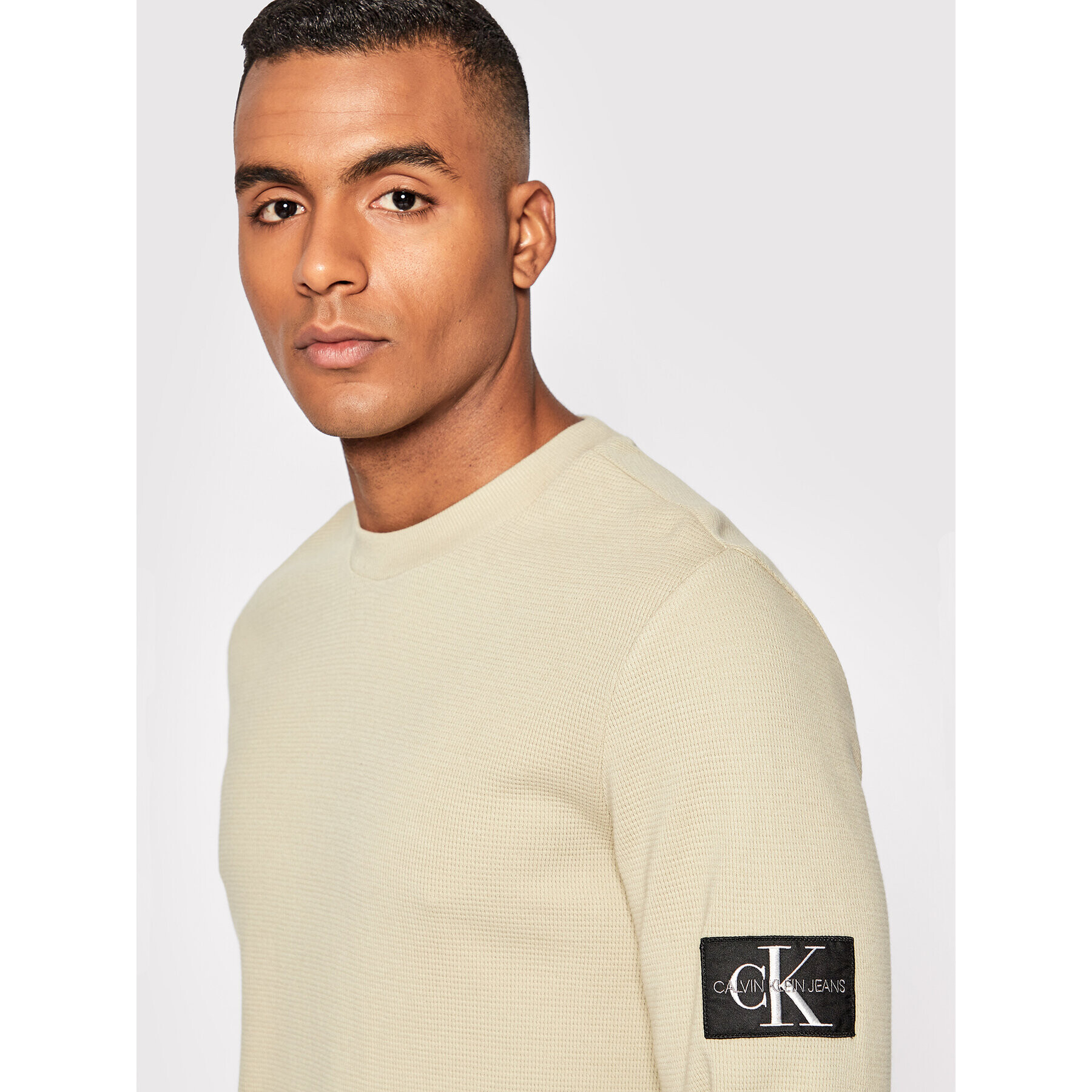 Calvin Klein Jeans Пуловер J30J316610 Бежов Regular Fit - Pepit.bg