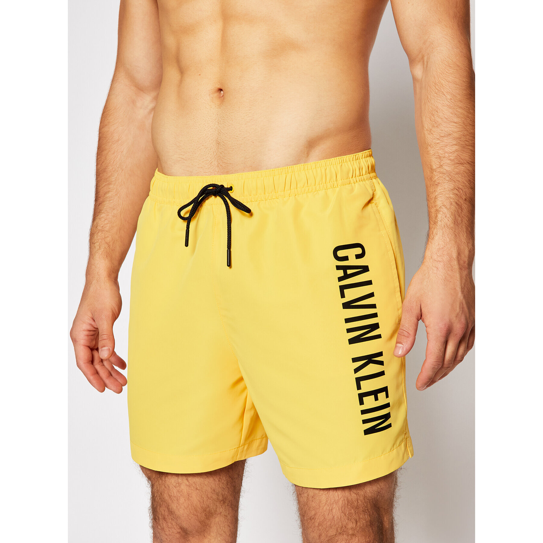 Calvin Klein Swimwear Плувни шорти Medium Drawstring KM0KM00570 Жълт Regular Fit - Pepit.bg