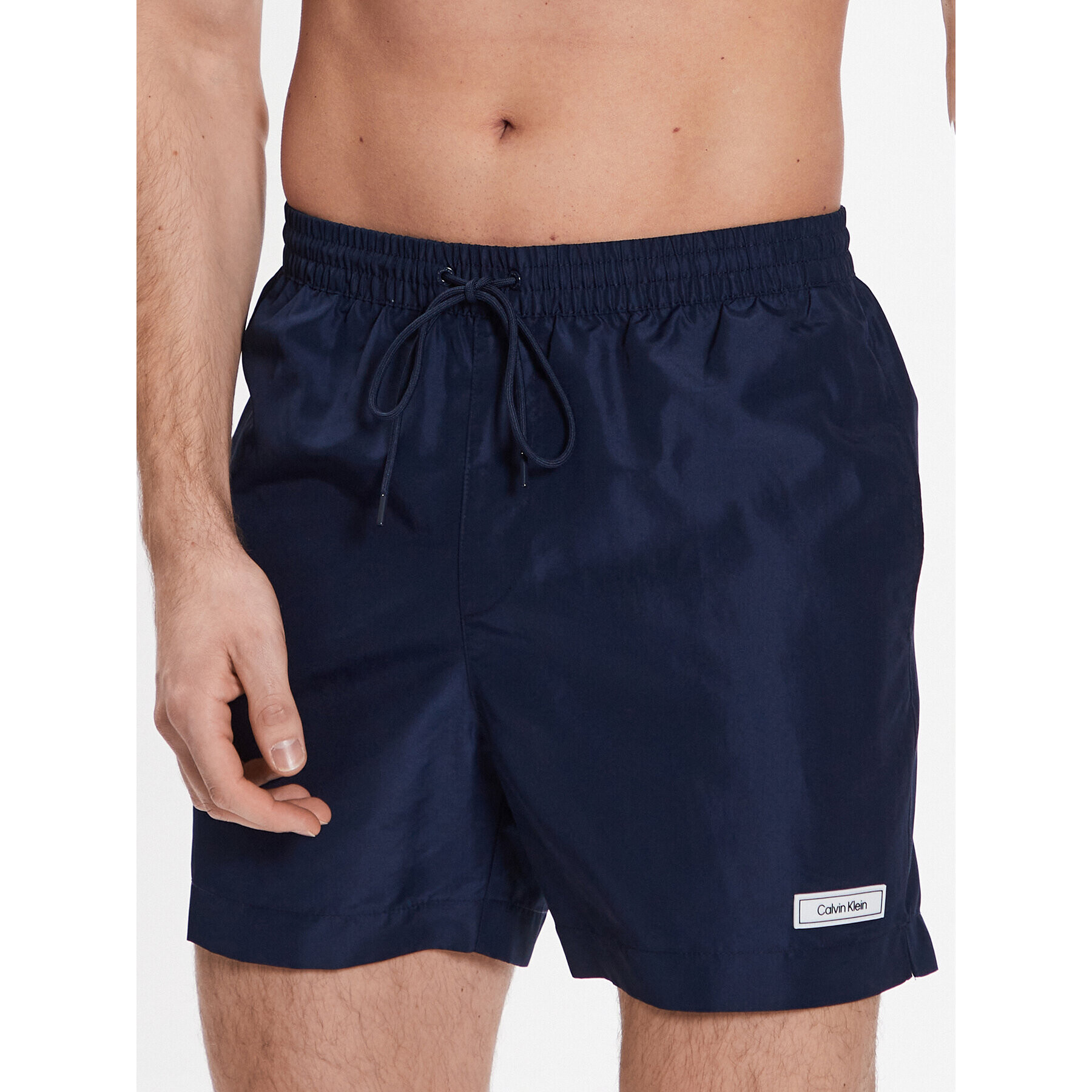 Calvin Klein Swimwear Плувни шорти Medium Drawstring KM0KM00812 Тъмносин Regular Fit - Pepit.bg