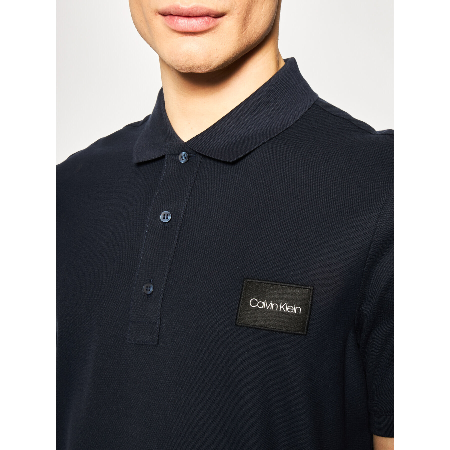 Calvin Klein Тениска с яка и копчета Refined Pique Logo Badge K10K105256 Тъмносин Regular Fit - Pepit.bg