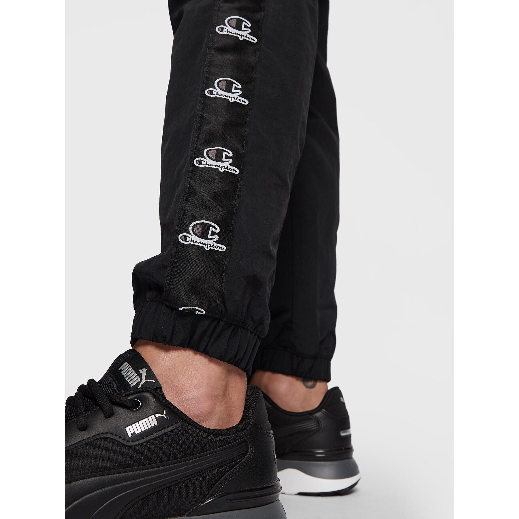 Champion Долнище анцуг 115495 Черен Regular Fit - Pepit.bg