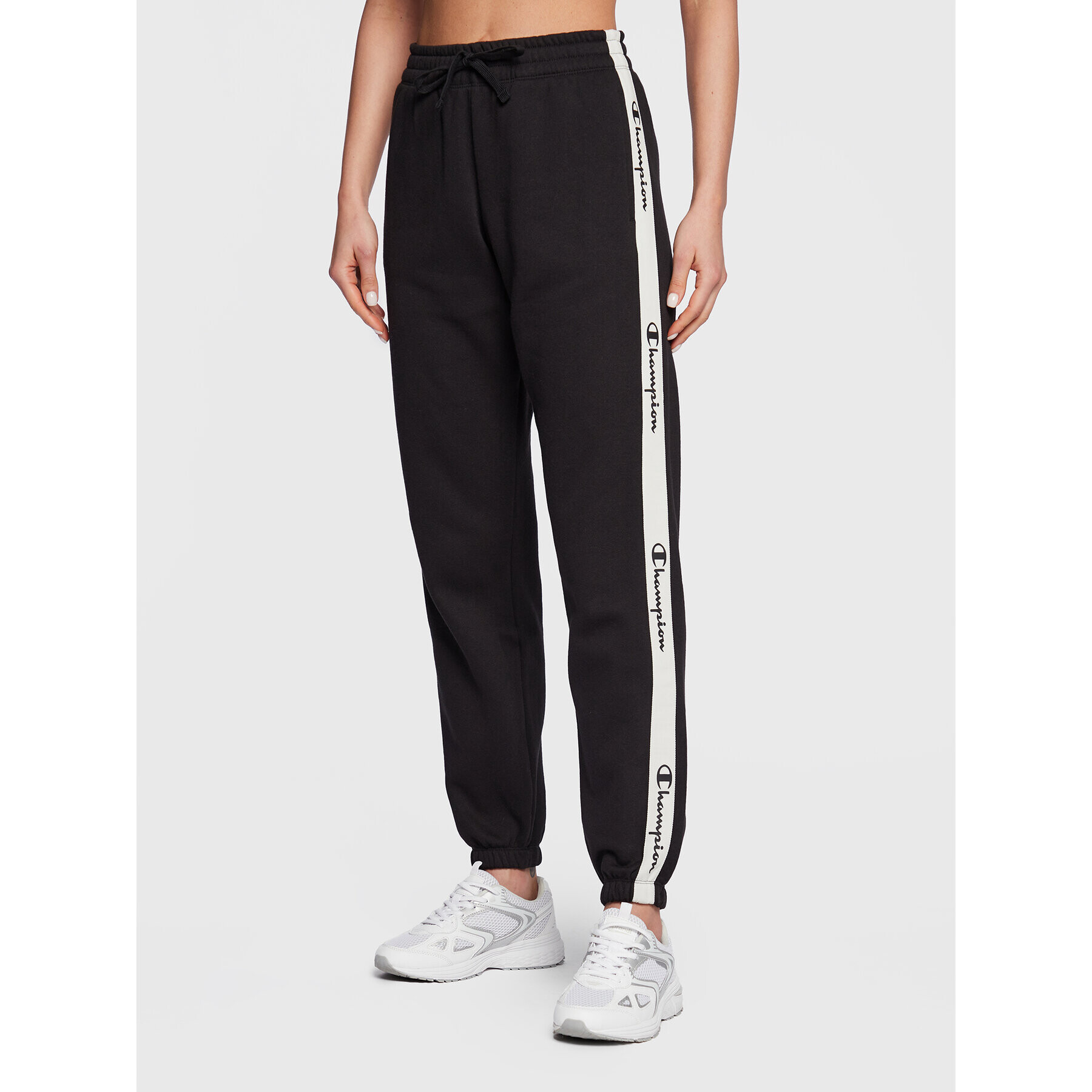 Champion Долнище анцуг Slide Tape 115576 Черен Regular Fit - Pepit.bg